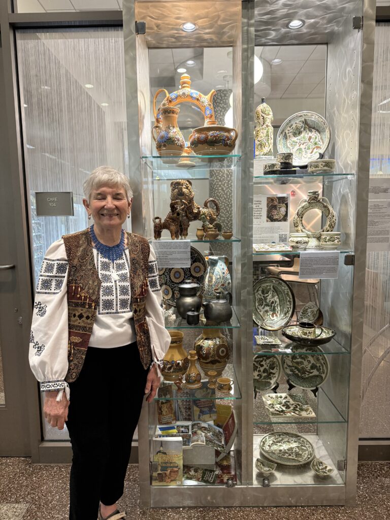 Artist Natalia Kormeluk with her collection of her Ukrainian ceramics and pottery in 2025