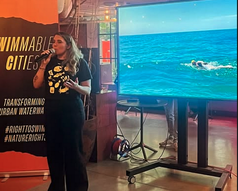 Baltimore ultramarathon swimmer Katie Pumphrey speaking at the Swimmable Cities Summit in Rotterdam 2025. Photo via Katie Pumphrey.